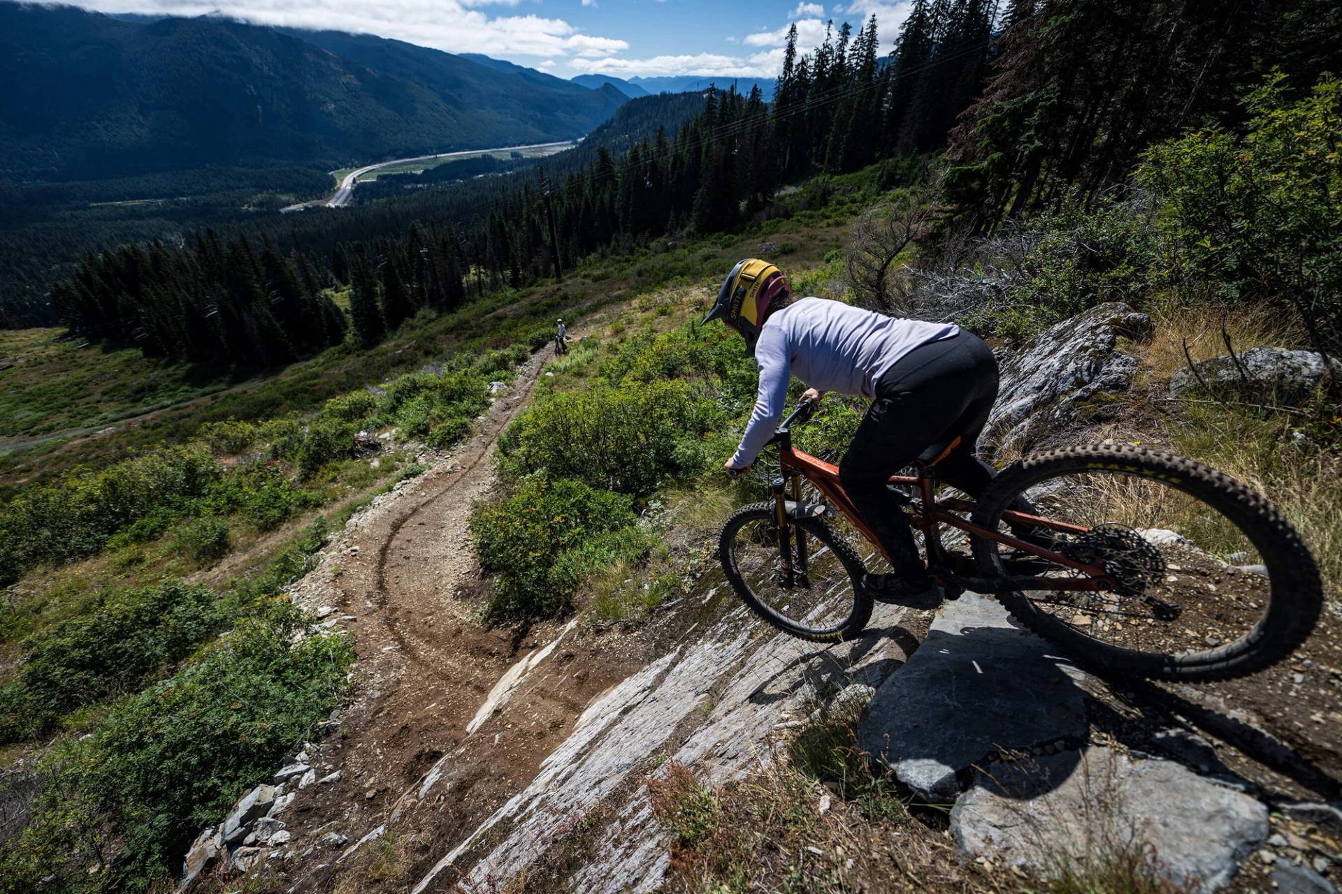 biker droping on slab on black forest trail