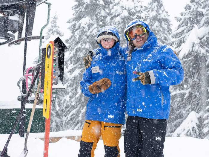 staff smiling in the snow