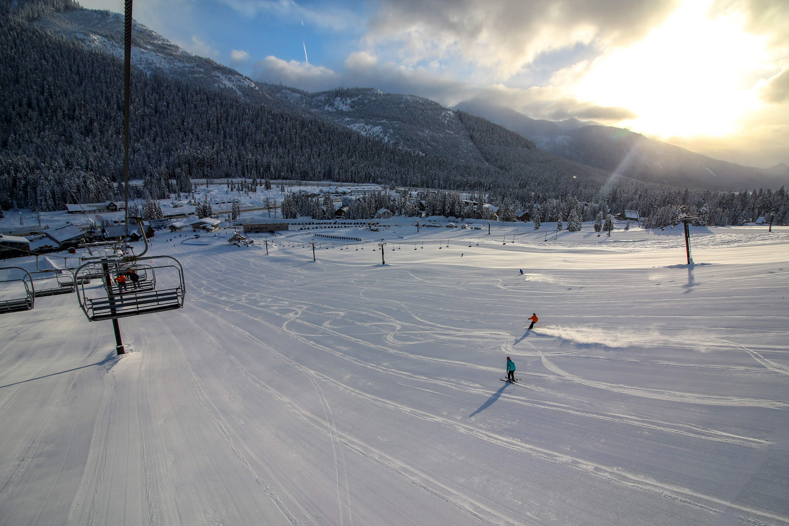 Two lone skiers enjoying fresh groomer at Summit West