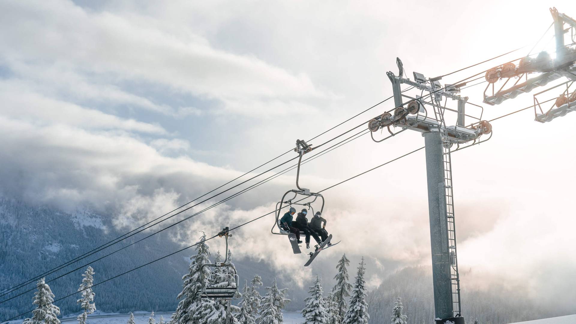 View of snowboarders on Silver Fir Express