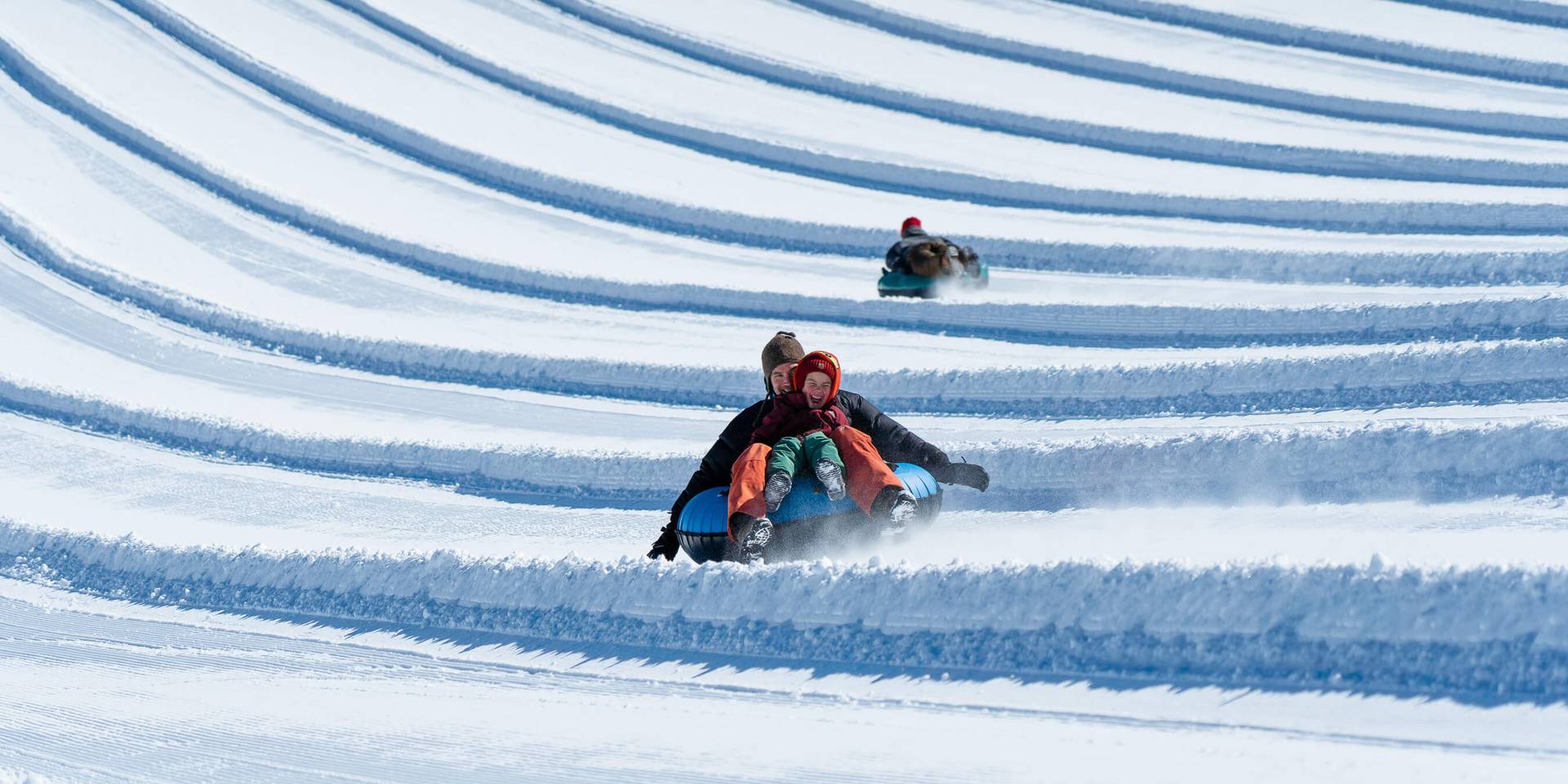 happy kid tubing with dad