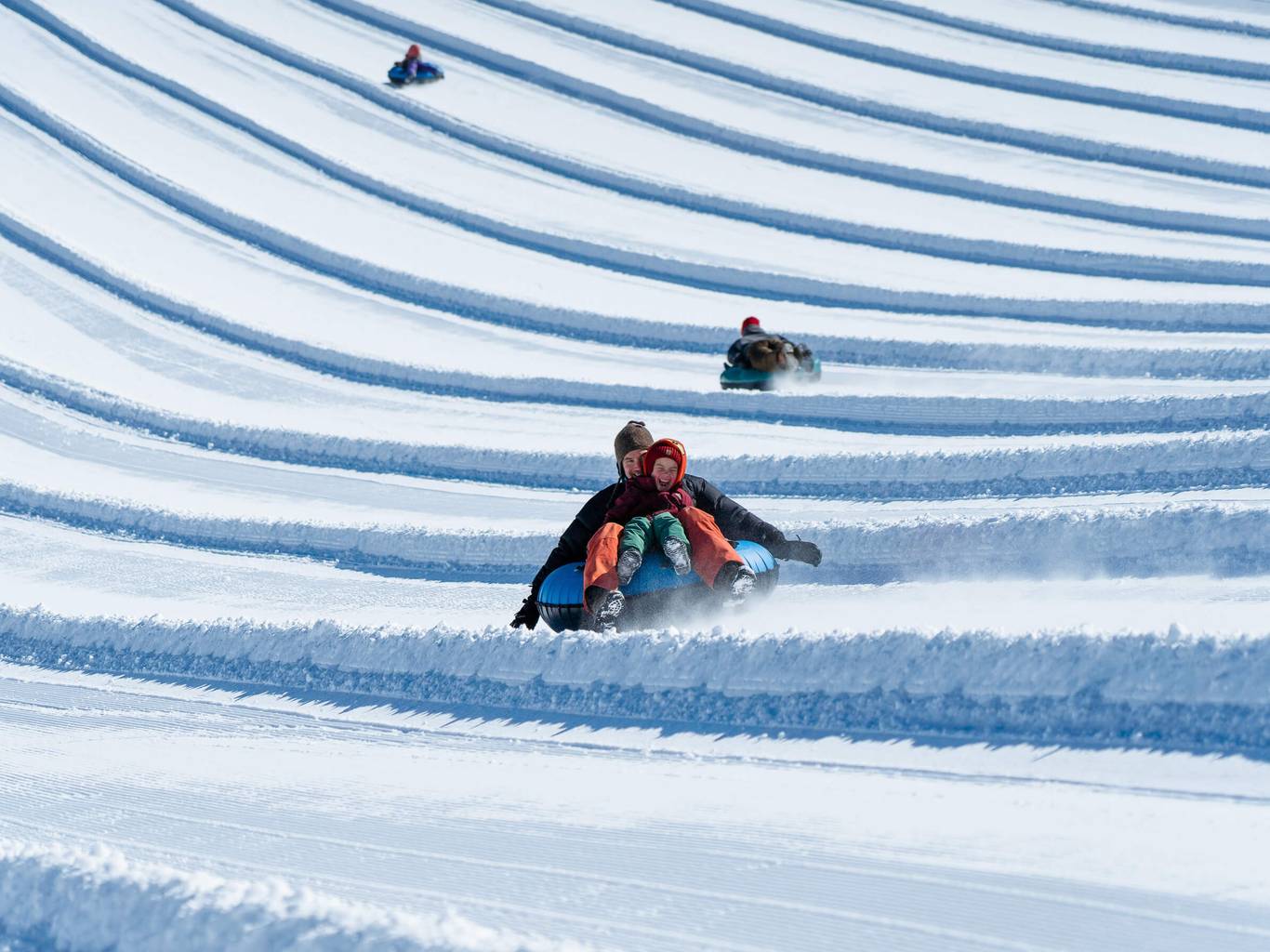 happy kid tubing with dad