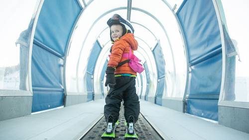 little girl dressed up for ski lessons