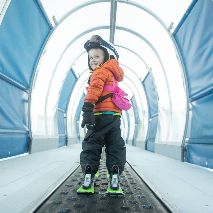 little girl dressed up for ski lessons