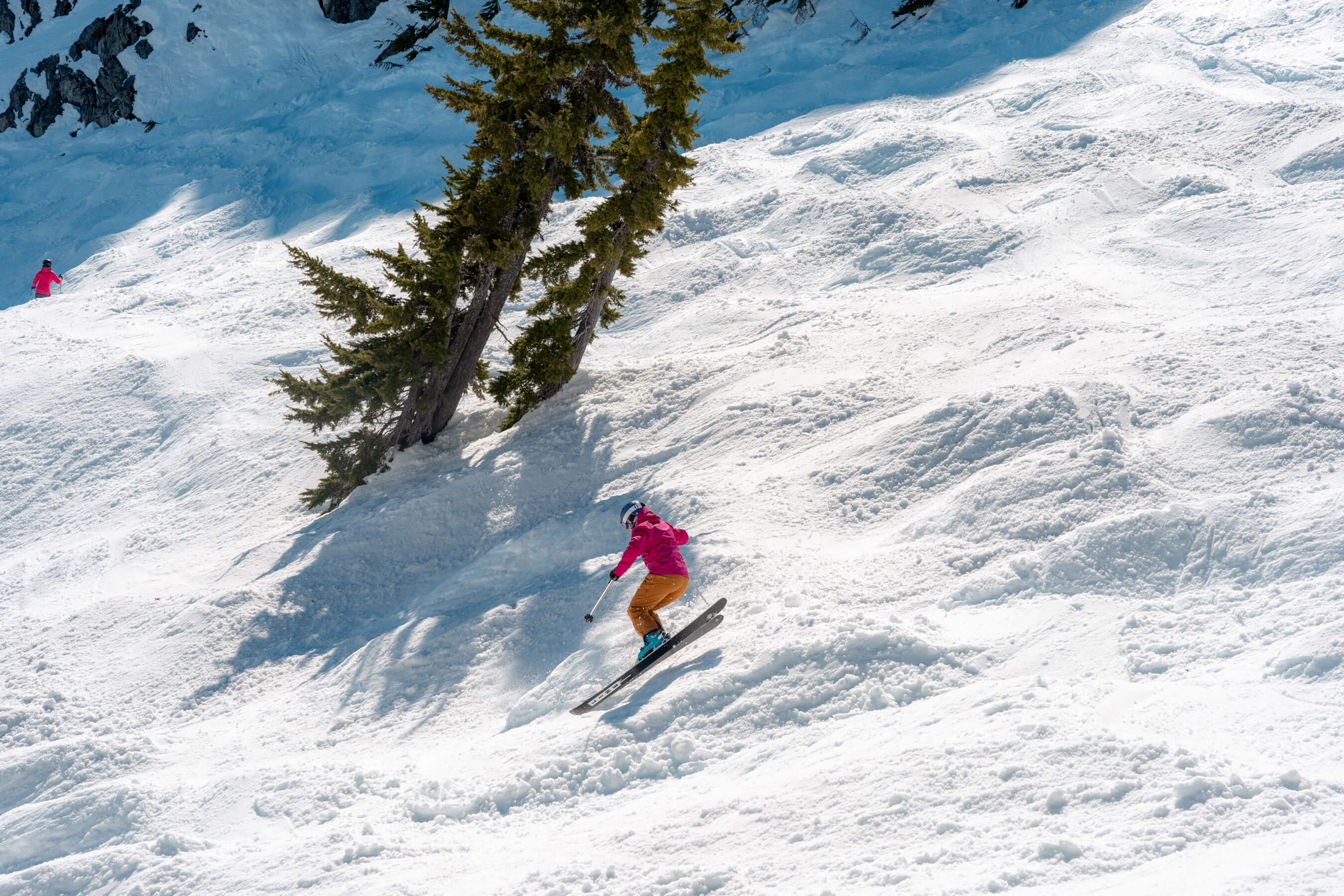 skier jumps on steep slope