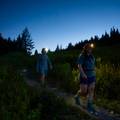 two hikers with headlamps walking on the pacific crest trail