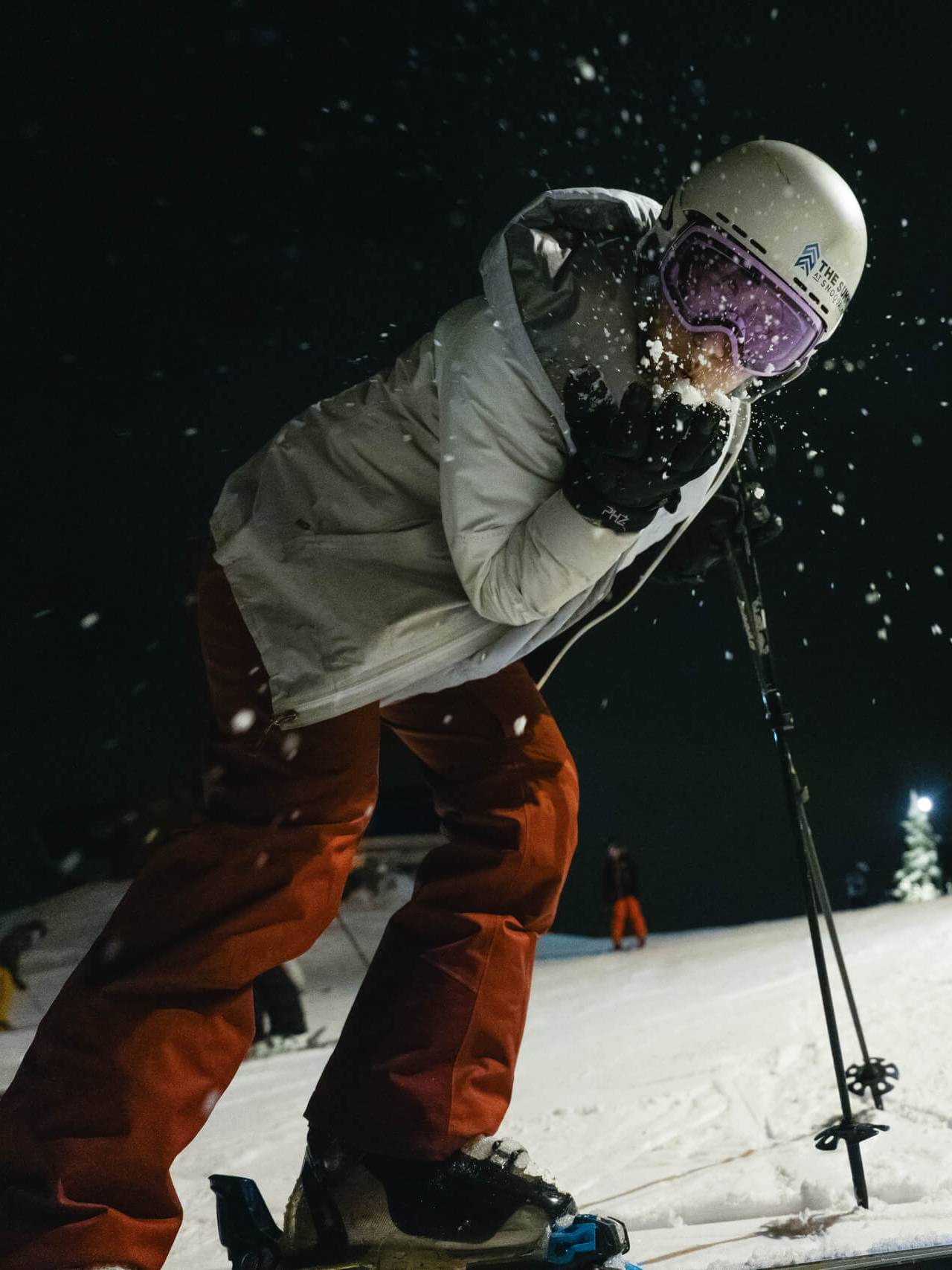 skier hanging out at night on the slopes