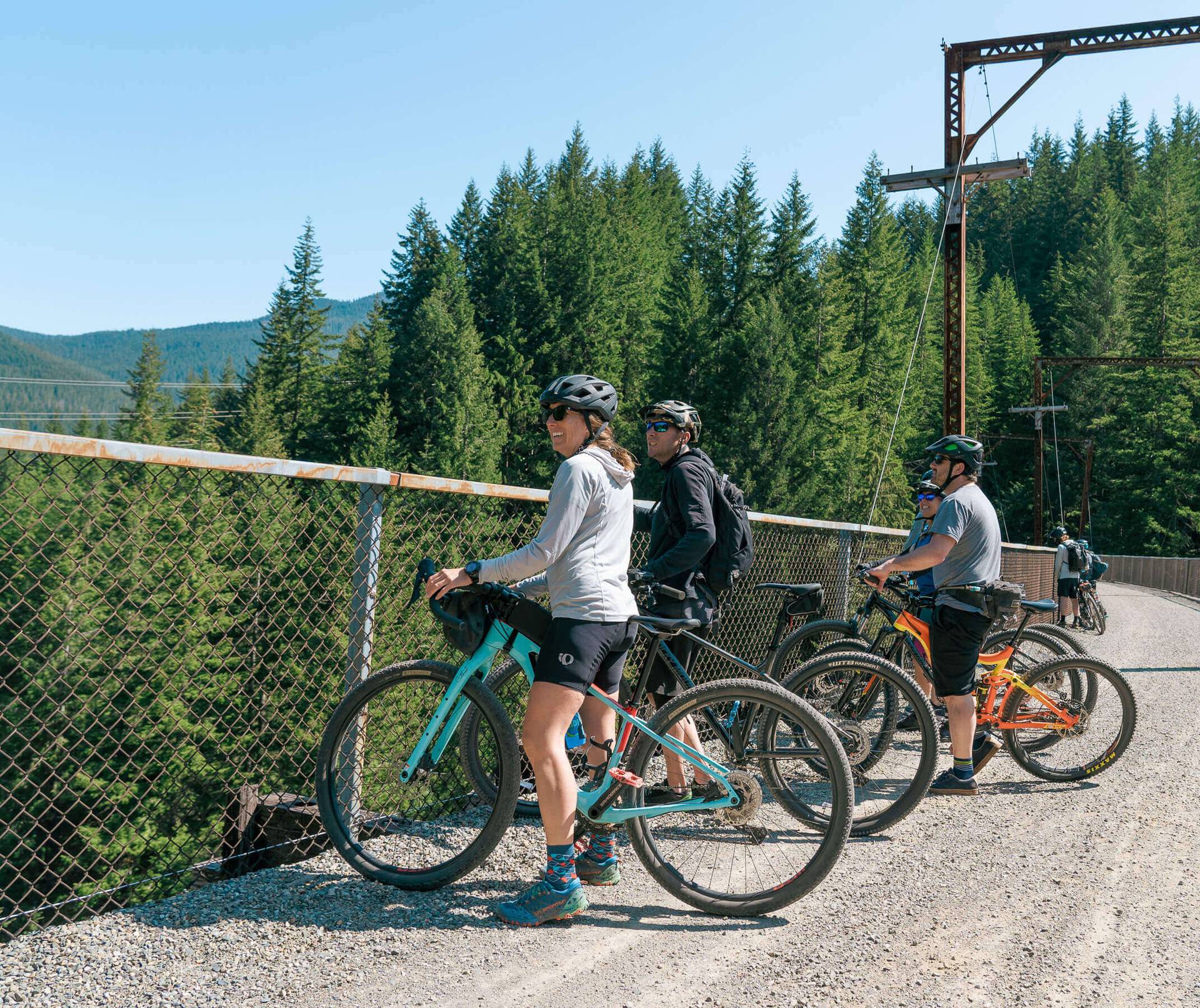 group of bikers on scenic trail looking out