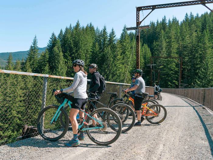 group of bikers on scenic trail looking out