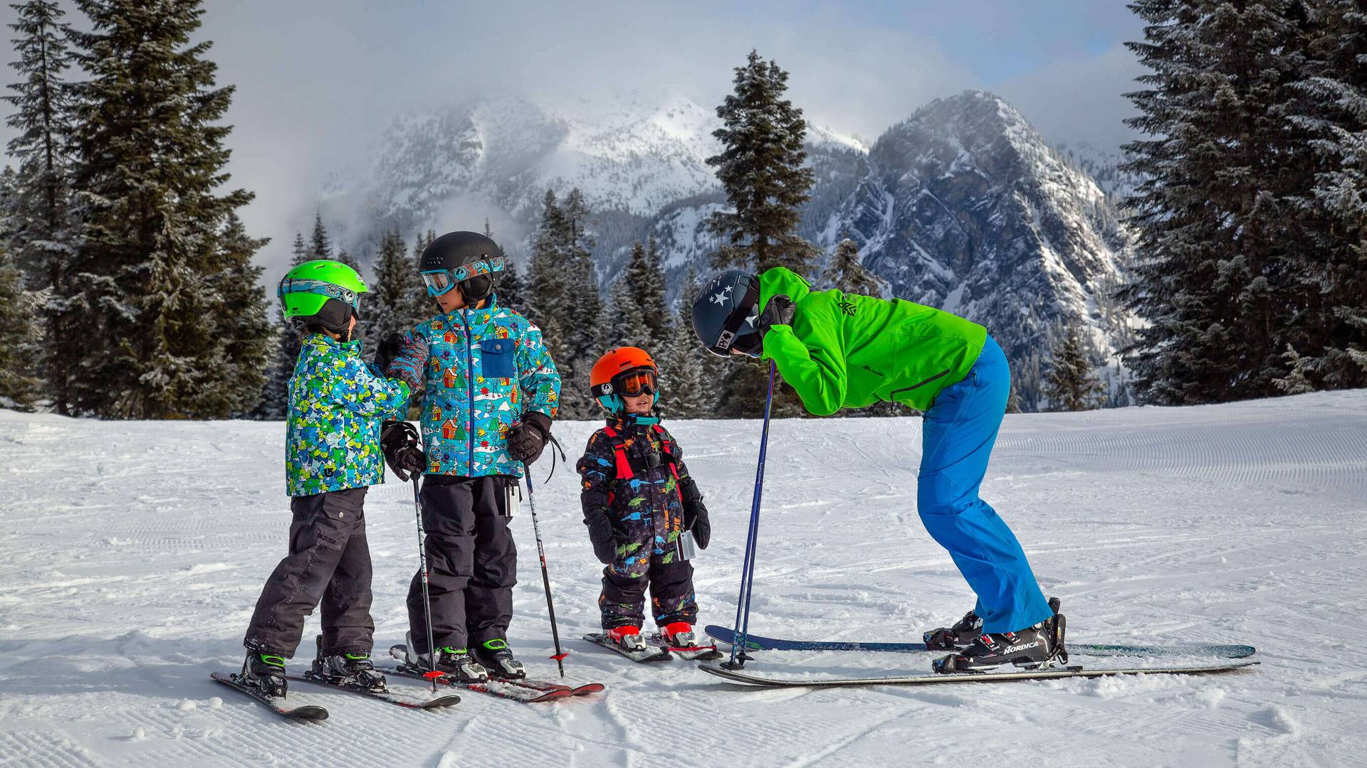 kids and ski instructor with guye peak