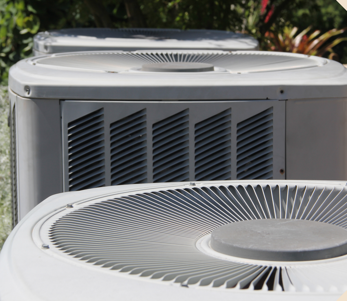 Close up photo of the tops of AC units