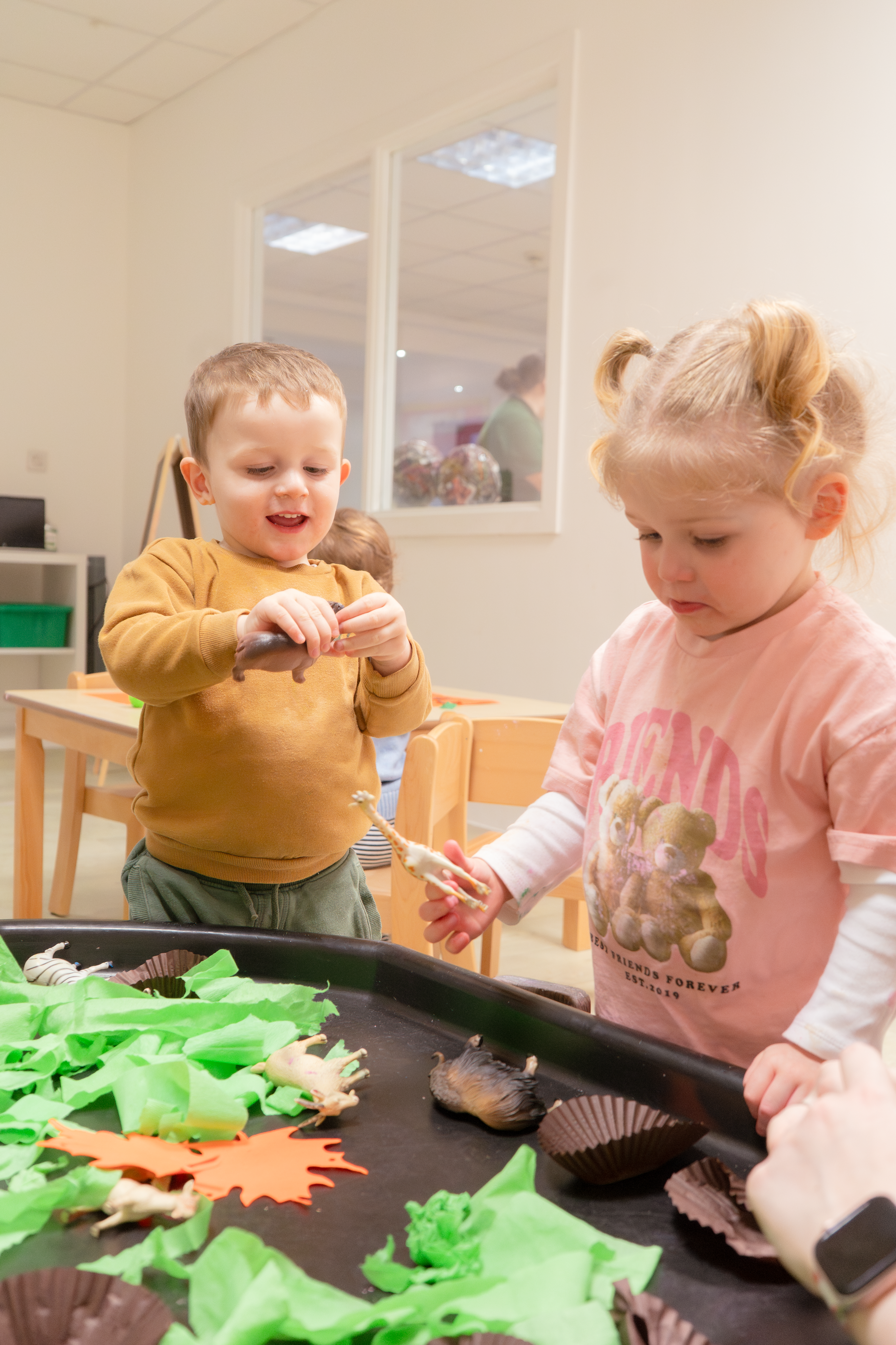 A baby exploring illuminated sensory blocks
