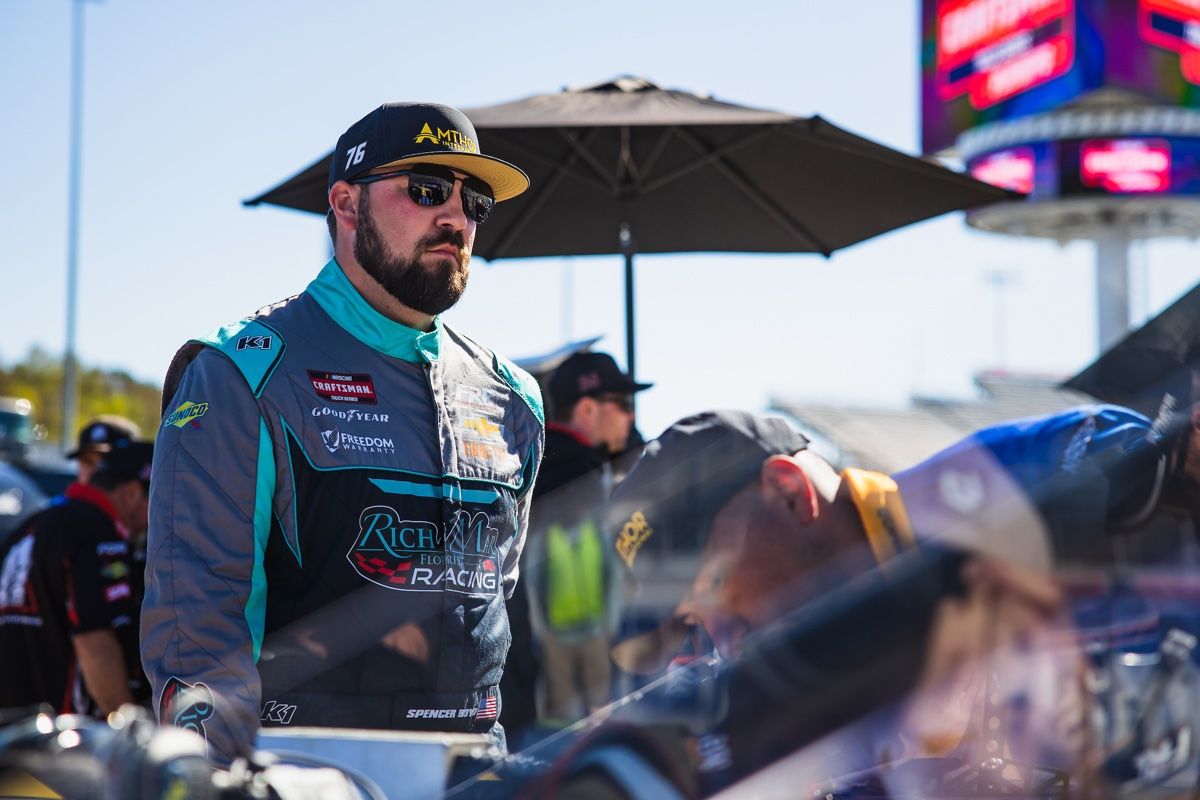 Spencer Boyd in his racing suit on pit road, #76 Amthor / Reaume Brothers Racing