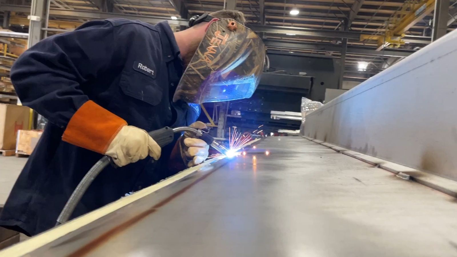 Amthor welder building a tank on the facility floor