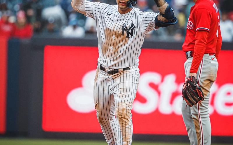 Gleyber Torres puts up both his hands after hitting a double.
