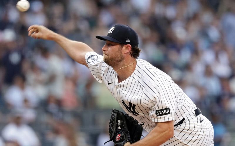 Cole defies weather, Boone's hook to help Yankees snap skid