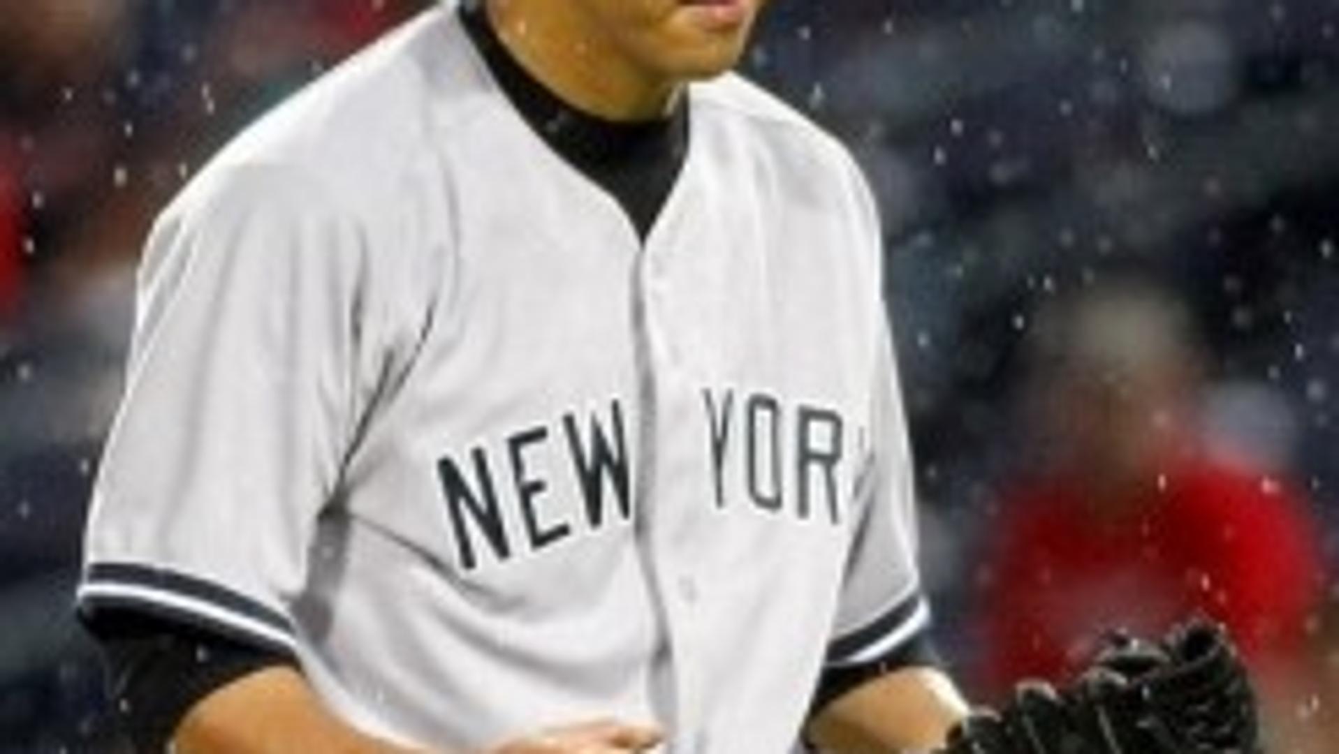 New York Yankees' Kuroda reacts after striking out Atlanta Braves' Bourn in their MLB interleague baseball game at Atlanta