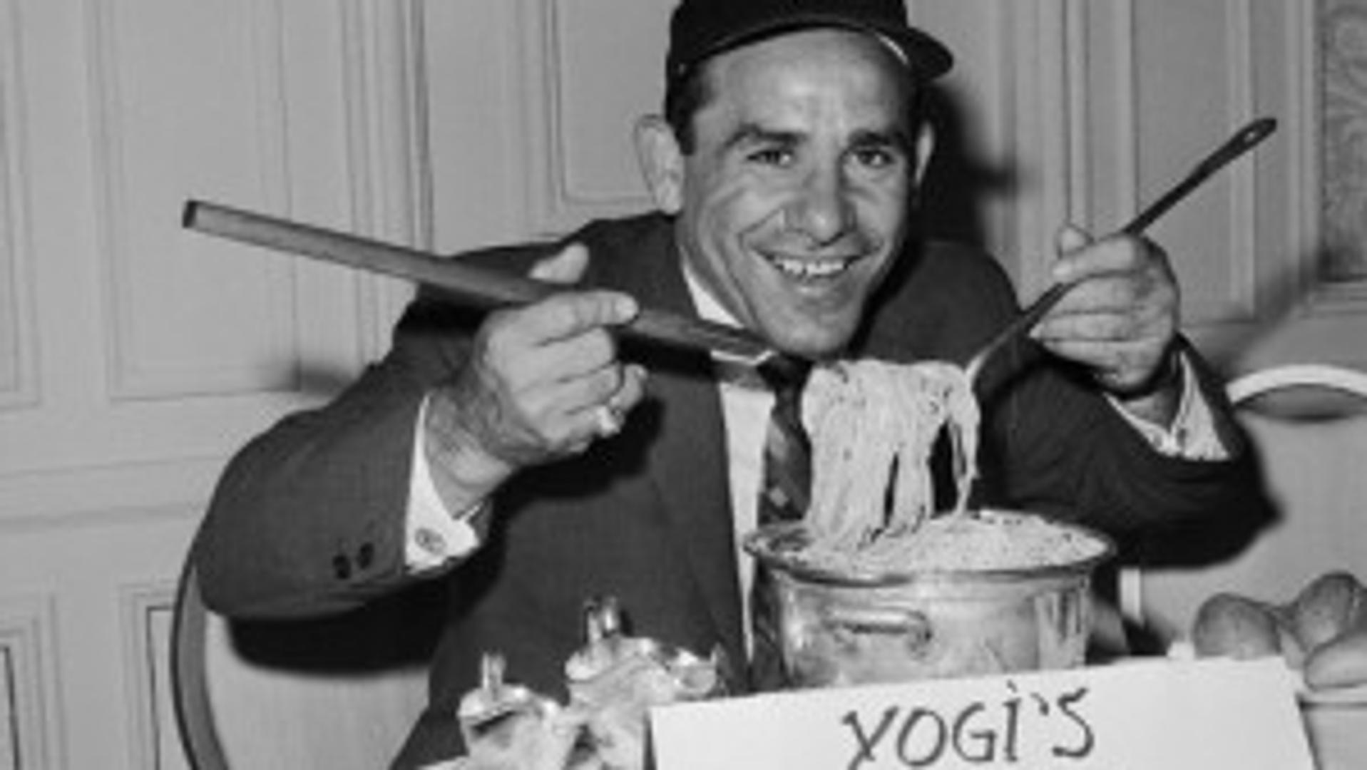 Yogi Berra Digging into Pot of Spaghetti