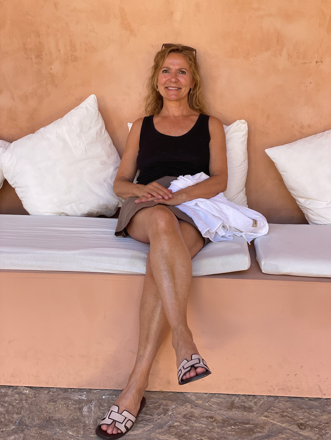 a black board with the words `` whatever it takes '' written on it is hanging on a white wall .