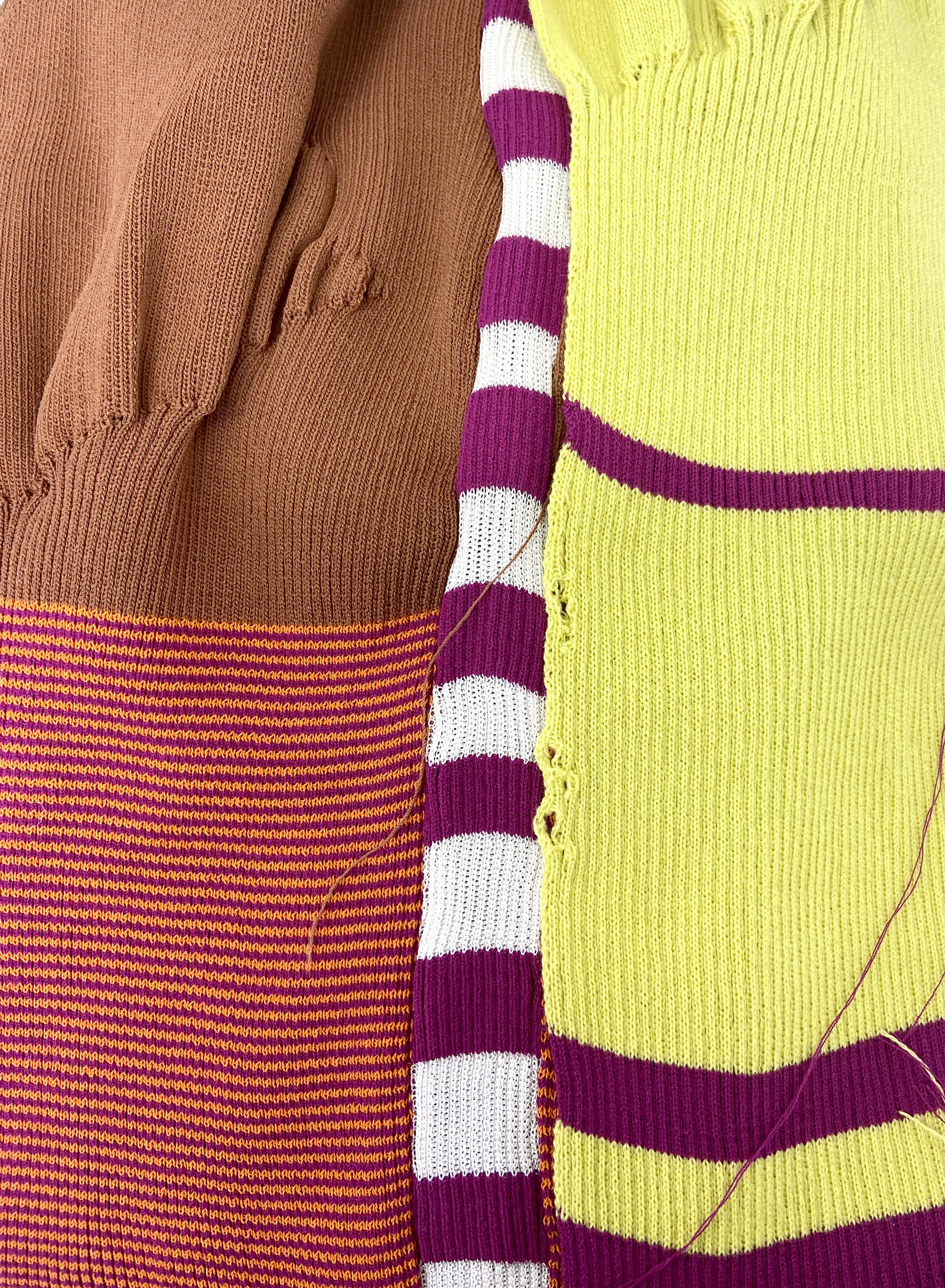 Close up image of three knitted fabrics that have been made from stripe and rib techniques.