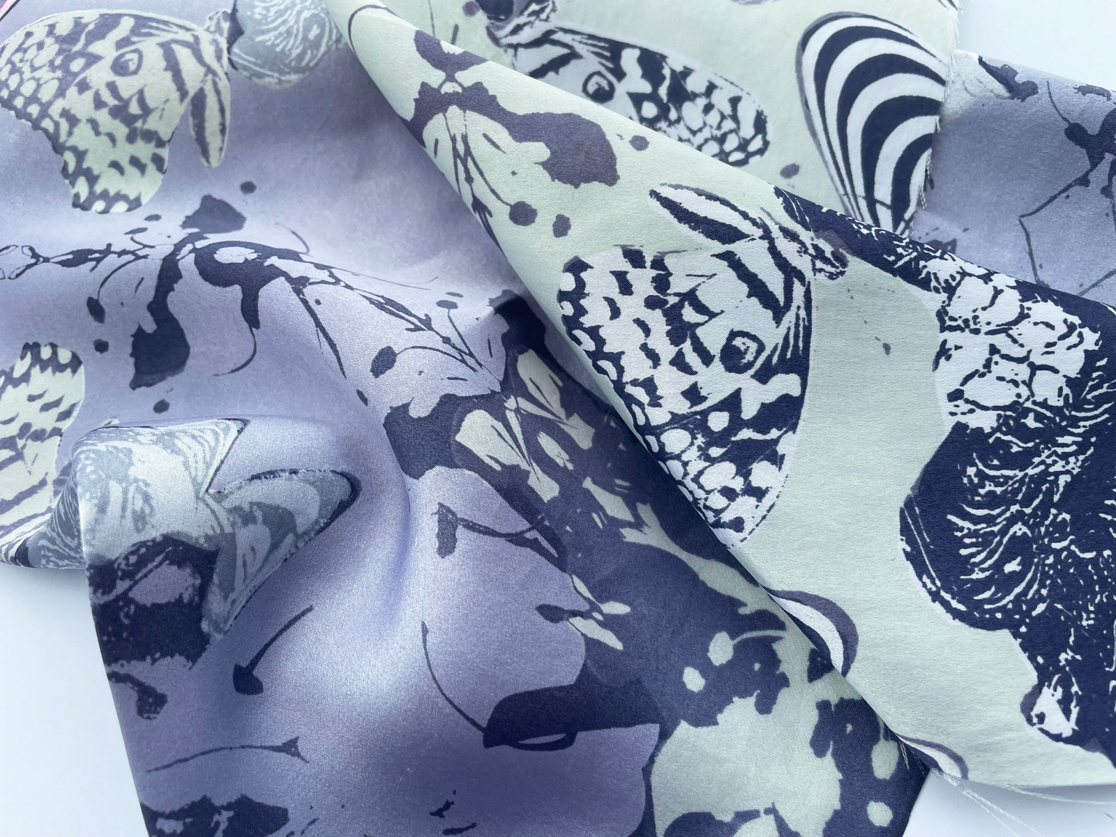 Bacterial dyes mixed with plant based dyes, screen printed onto silk.