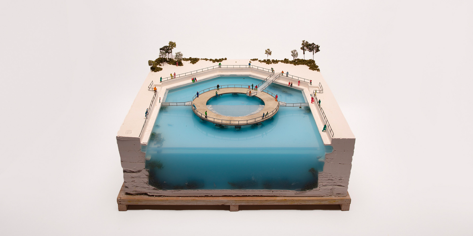 large-scale plaster and blue silicone model showing the stage. A balustrade wraps around the edge of the dock and the stage.