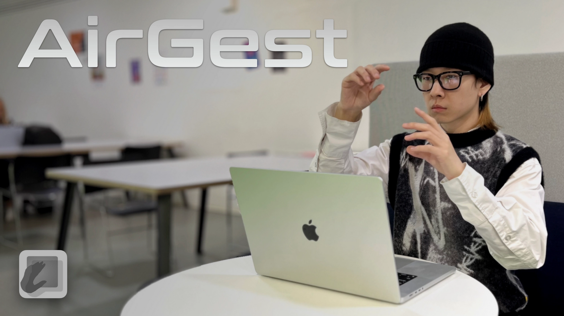 Photo of student with laptop, 'AirGest' text overlaid