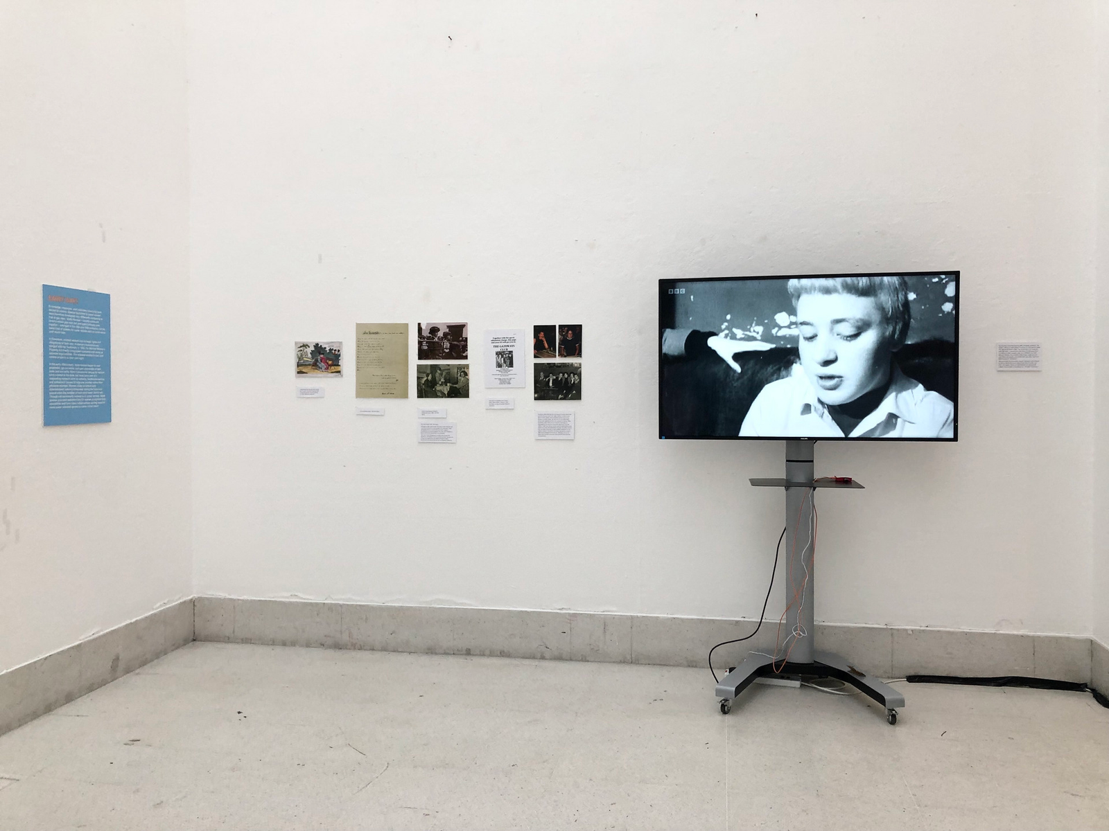 Installation view of the exhibition showing a video clip and some photographic documentation.