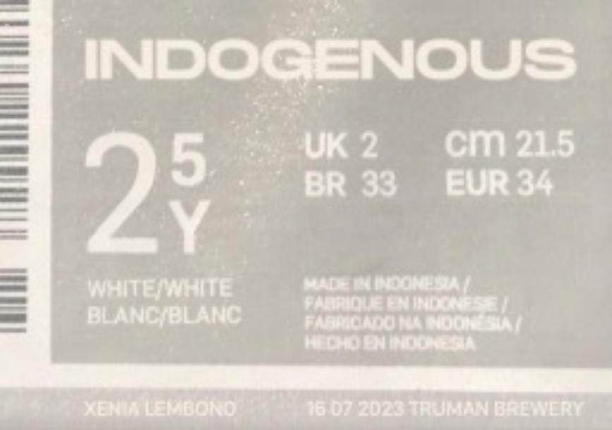 Sepia image of a clothing label and barcode for INDOGENOUS brand