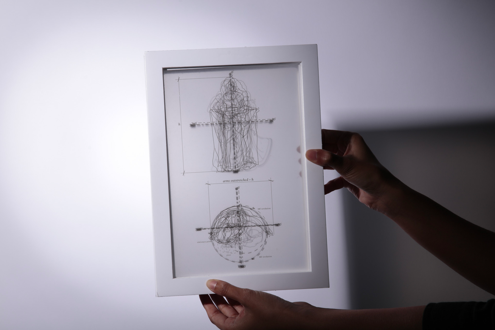 A stack of frames with drawings printed on acetate.