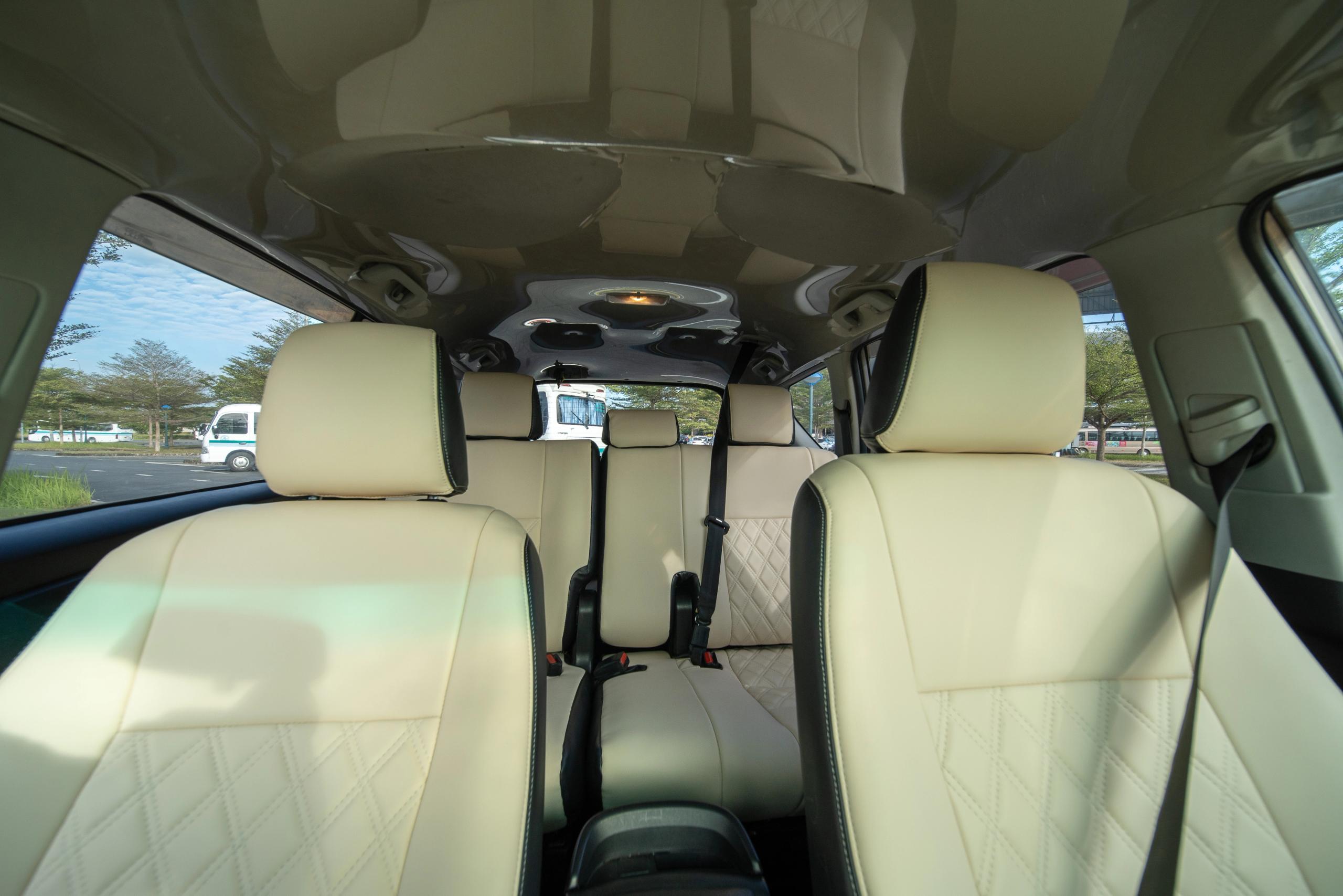 Empty passenger cabin and seat belts in a seven-seat vehicle