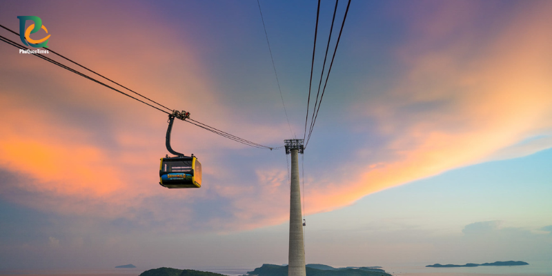 Hon Thom cable car cabins against a sunset sky
