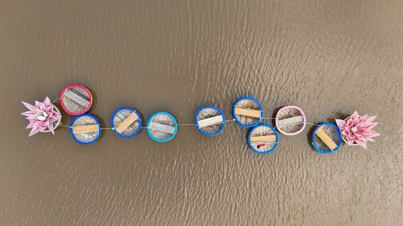Empty round basket boats photographed from above on the water