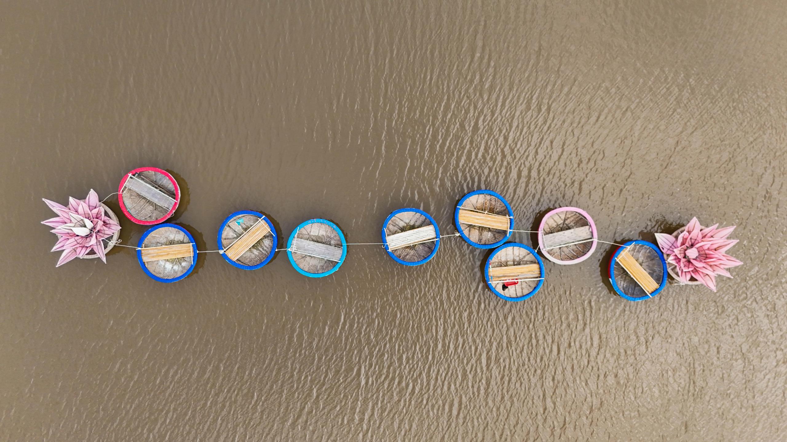 Empty round basket boats photographed from above on the water