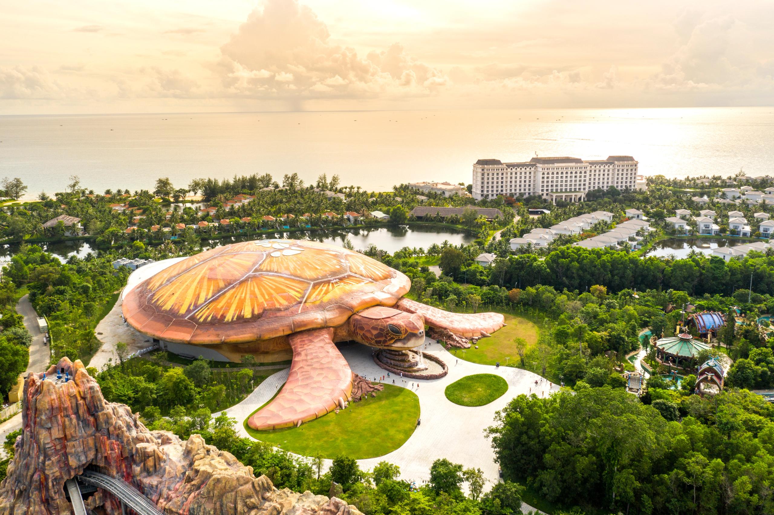 The turtle-shaped aquarium building among green gardens