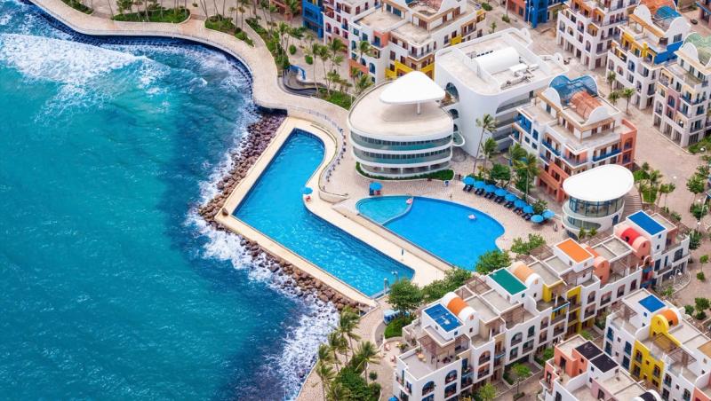 An aerial view of the Santo waterfront pool and neighbouring buildings