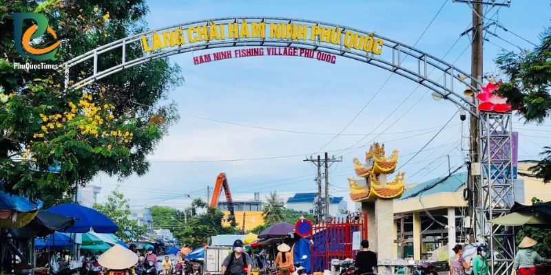 The signed entrance to Ham Ninh fishing village and the market street beneath it