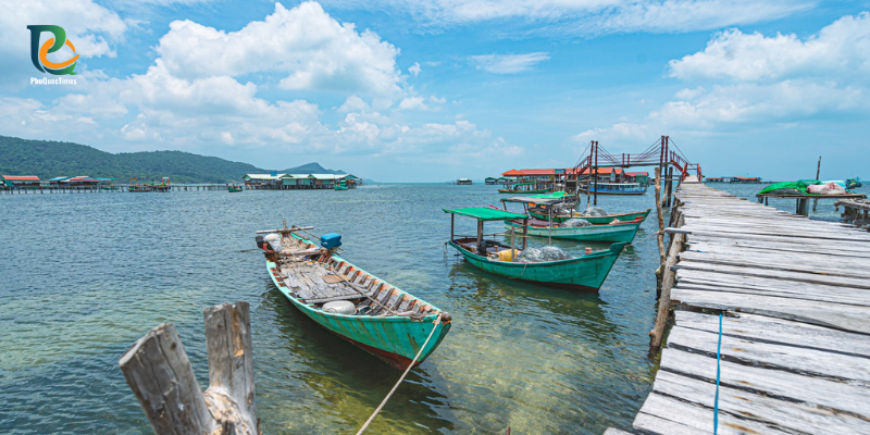Fishing boats beside a wooden pier at Rach Vem