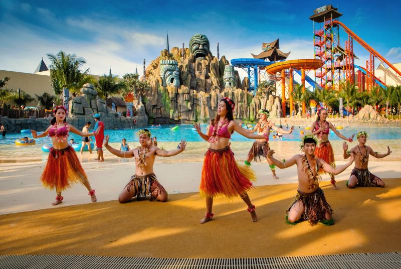 Dancers beside a pool at a water park