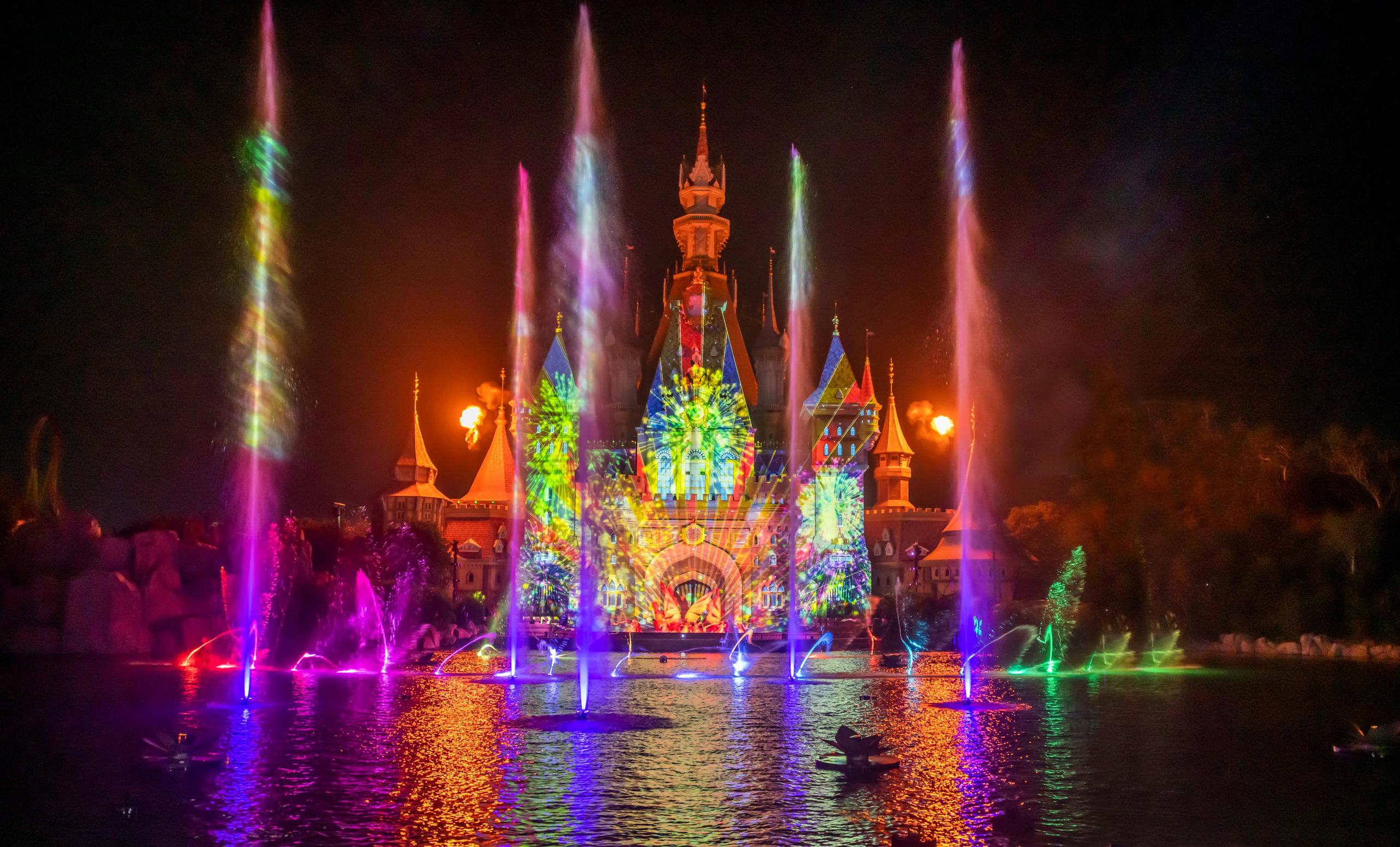 The VinWonders castle lit by fountains during the Once show