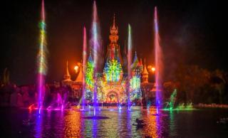 The VinWonders castle lit by fountains during the Once show