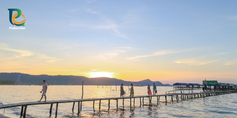 A wooden waterfront walkway at Rach Vem in evening light