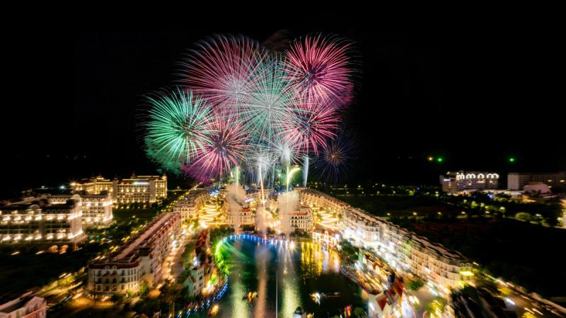 Fireworks above the Grand World canal and illuminated buildings