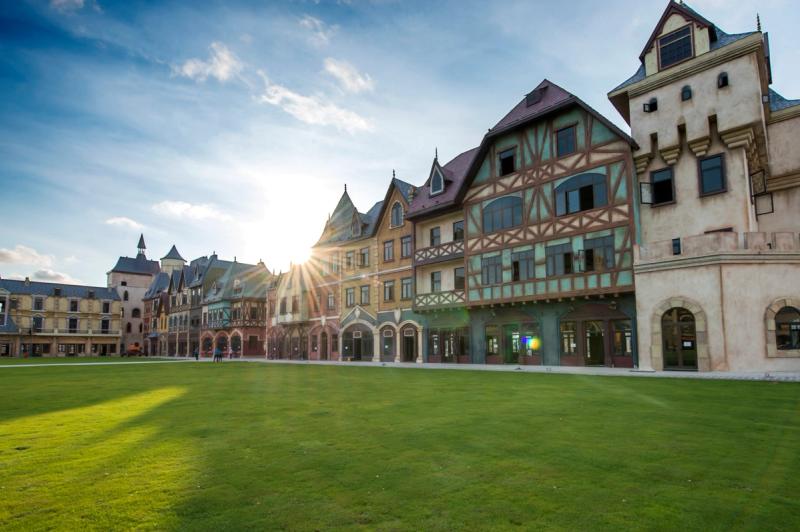 European-style facades beside a lawn at VinWonders