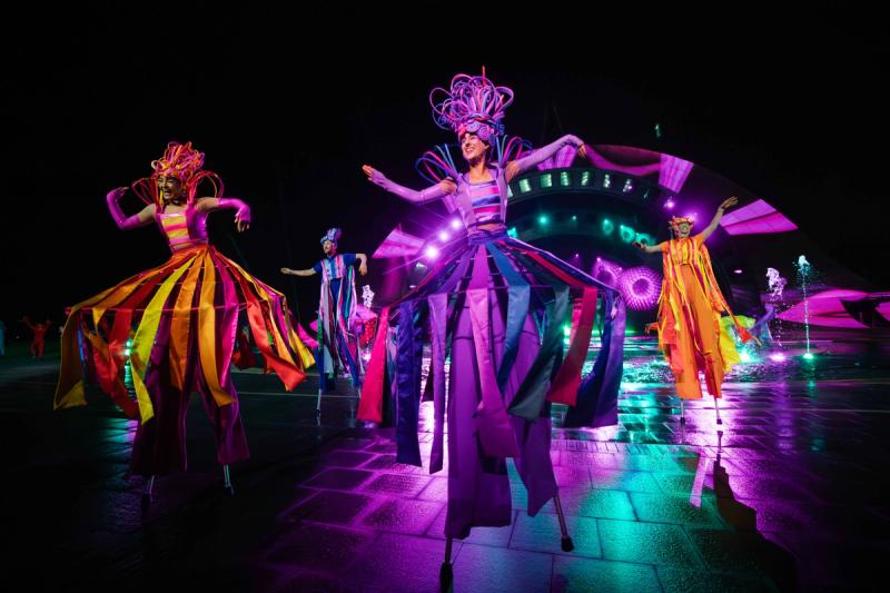 Dancers in bright costumes performing at Kiss of the Sea