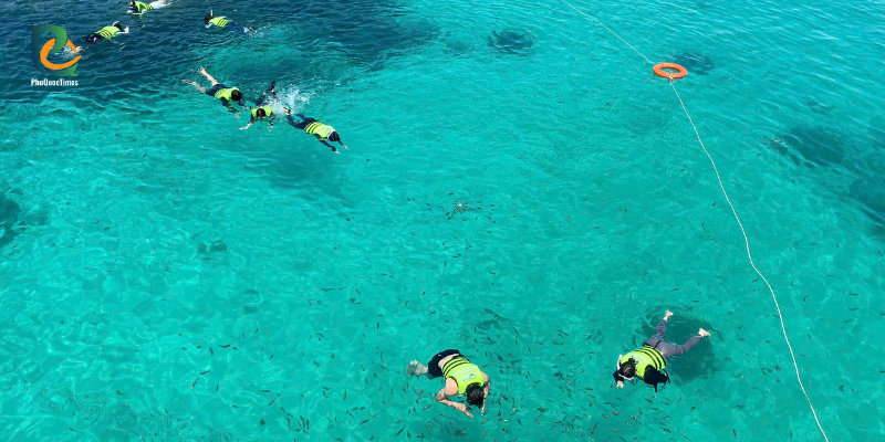 Snorkelers in clear water near Mong Tay Island