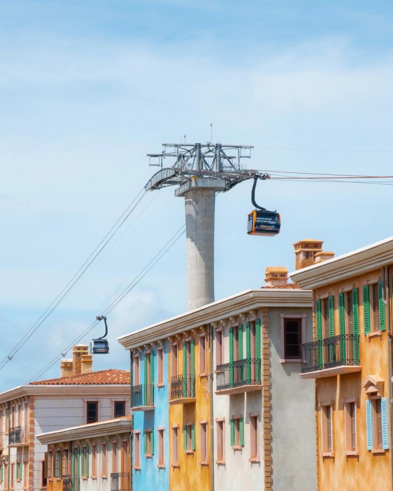 A cable-car tower above the terminal-side buildings in Sunset Town, on the mainland end of the Hòn Thơm crossing.