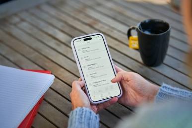 A person checking Australia Post tracking updates on their mobile phone app.