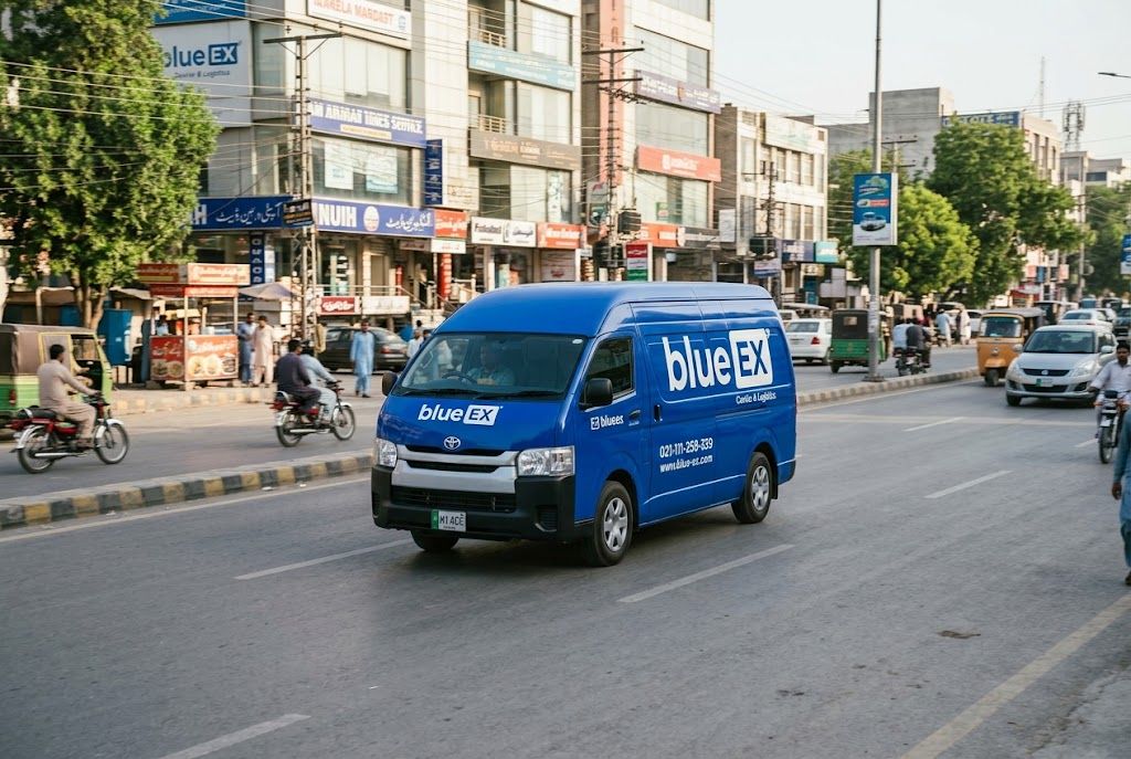 A modern BlueEX courier delivery van on a city road in Pakistan.