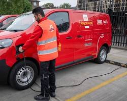 Red Royal Mail delivery van parked on a street in the UK